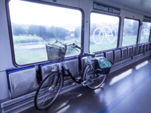 Cycling in Holland on the dykes along the river Linge. First with the bike in the train