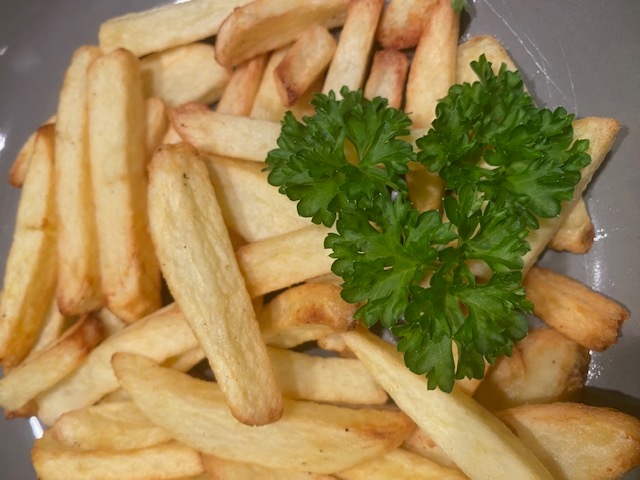 Crispy golden fries with parsly