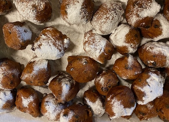 New Year's Eve "Oliebol"  with powdered sugar is a Dutch tradition